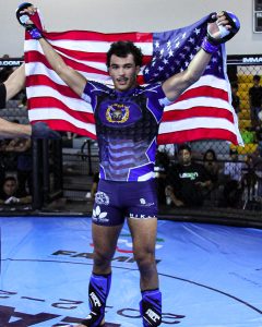 A men wearing MMA Gear or uniform