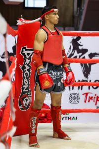 A men wearing a muay thai gear